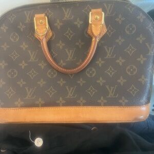 Louis Vuitton alma pre loved bag